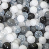 A collection of clear and opaque white, gray, and black plastic balls for play areas.