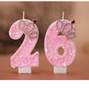 A set of two pink glitter birthday candles shaped like the number 26 with silver crown details