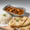 A serving of curry rice and flatbreads presented in disposable aluminum foil trays.