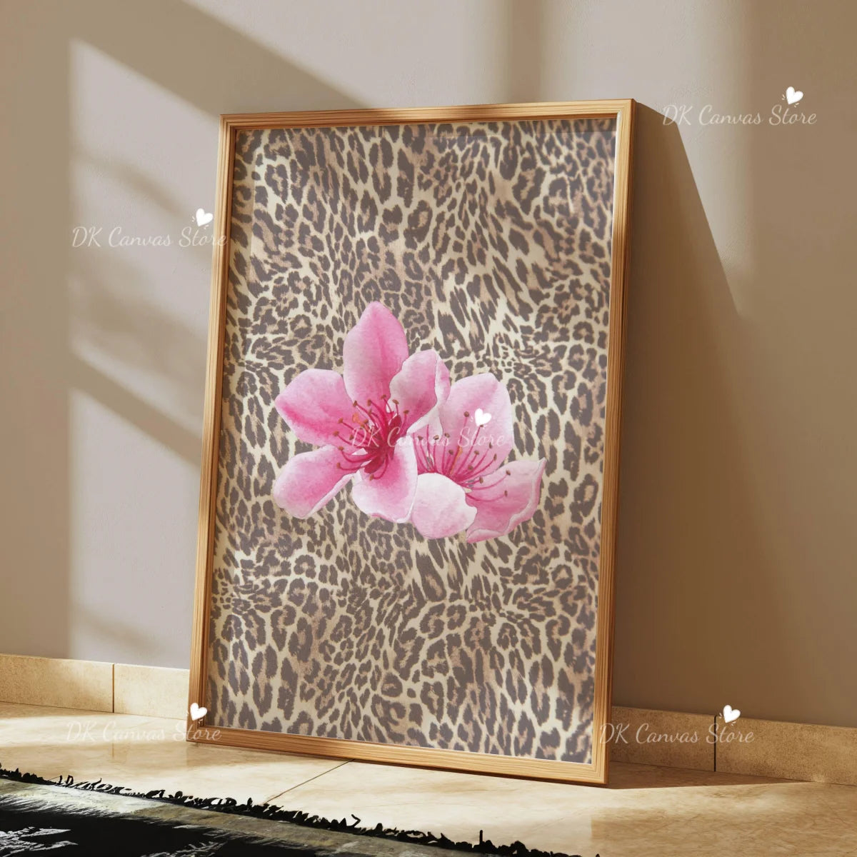 Framed canvas wall art featuring a pink leopard print background with a central hibiscus flower.