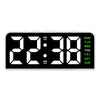 A black digital alarm clock displaying 22:38 with a mood light and day of the week display.