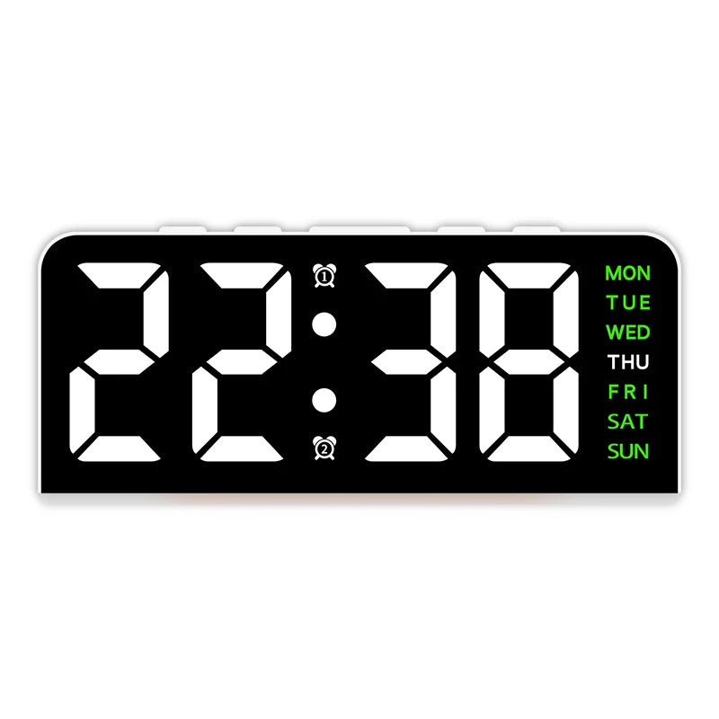 A black digital alarm clock displaying 22:38 with a mood light and day of the week display.