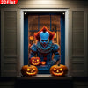 A terrifying clown figure with red hair and white face is displayed in a window frame decorated with pumpkins and a spider we