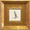 An elegant gold photo frame set featuring a white silhouette of a bird in flight.