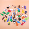 A collection of colorful 3D printed cartoon animal figurines including bears, cats, and various other creatures.