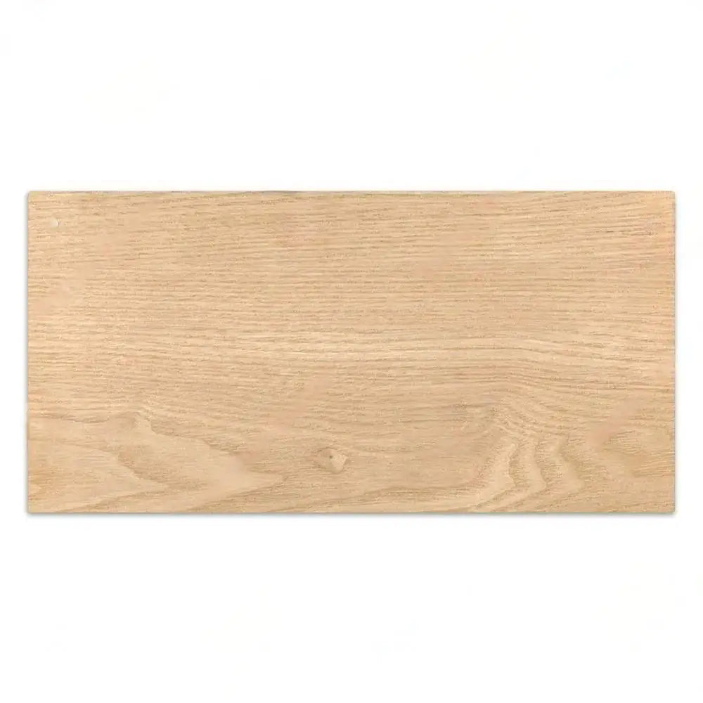 A light natural wood plank used as a custom wooden sign for home decor.