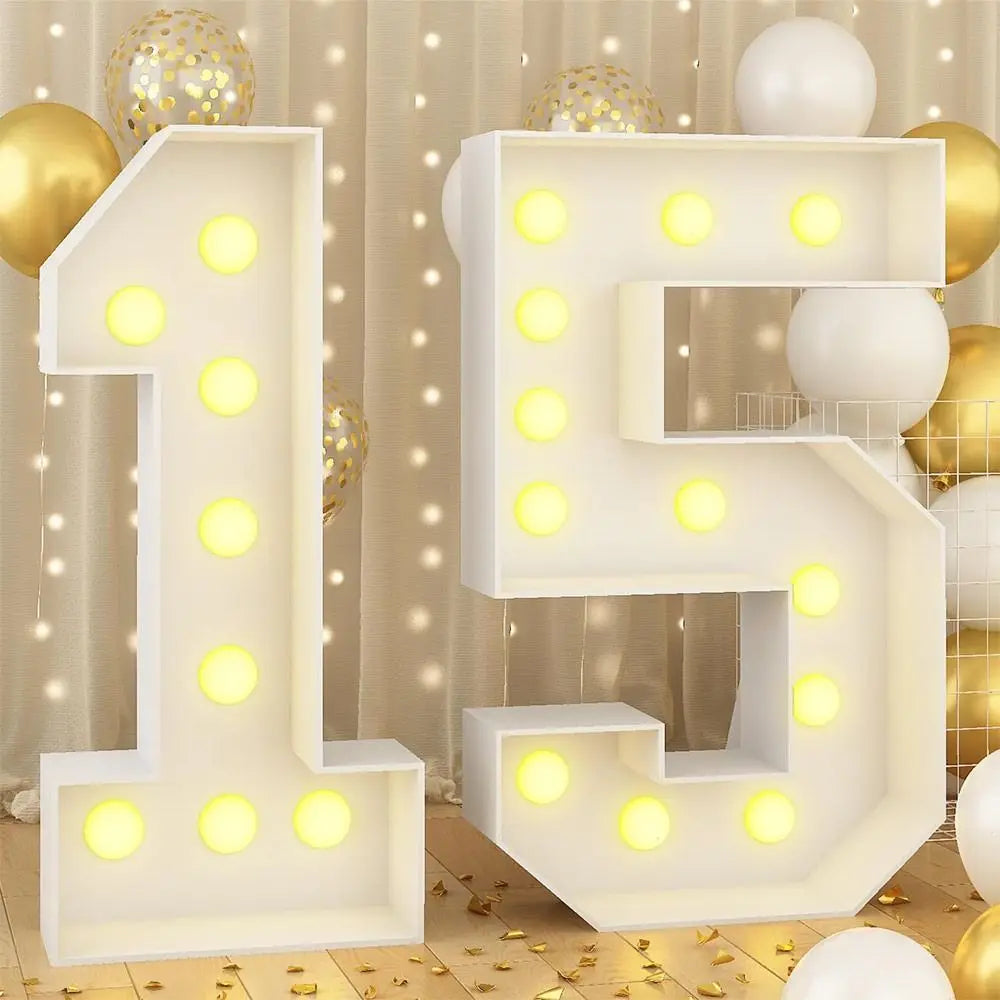 A large white LED light-up number 1 and 5 made of acrylic or plastic, displayed with gold balloons in a party setting.