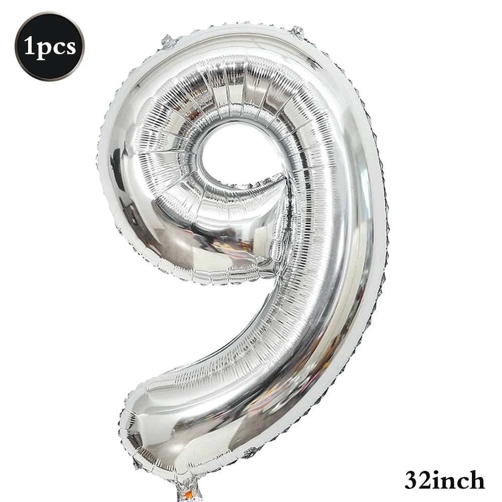 Silver foil number balloon shaped like the number 9, measuring 32 inches.