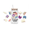 A clear glass jar filled with decorative stickers and a straw, set against a white background.