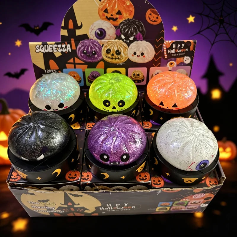 A box of sensory squishy blind box stress relief toys featuring various Halloween-themed, glowing, and textured spherical toy