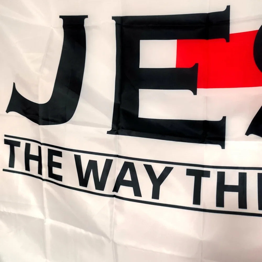 A banner featuring large black and red letters spelling out JESUS and the phrase THE WAY THROUGH on a white background.