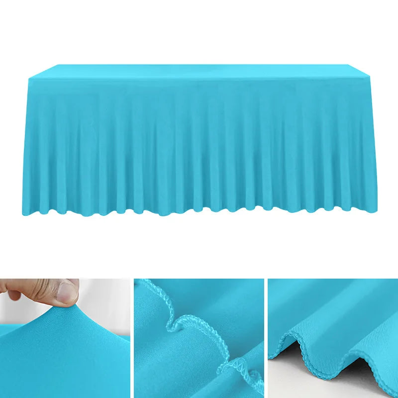 A bright cyan stretch rectangle tablecloth draped over a table, showing its pleated texture and fabric detail.
