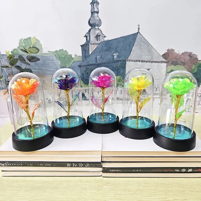 A set of glass vials containing colorful flowers used as an eternal rose LED night light display.