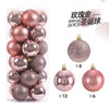 A set of 24 festive Christmas ball ornaments in rose gold and silver glitter finishes for holiday decoration.
