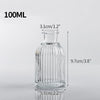 A clear glass vase with ribbed texture, measuring 9.7cm high and 5.7cm wide.