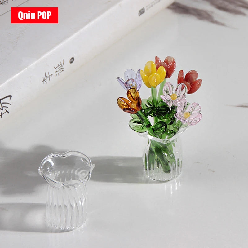 A glass flower bouquet featuring colorful glass flowers in a clear vase for home decor.