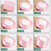 A collection of pink silk satin ribbons in various widths, ranging from 0.3cm to 5cm, displayed on a wooden surface.