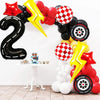 A large black foil number 2 arch decorated with red and yellow balloons for a birthday party.
