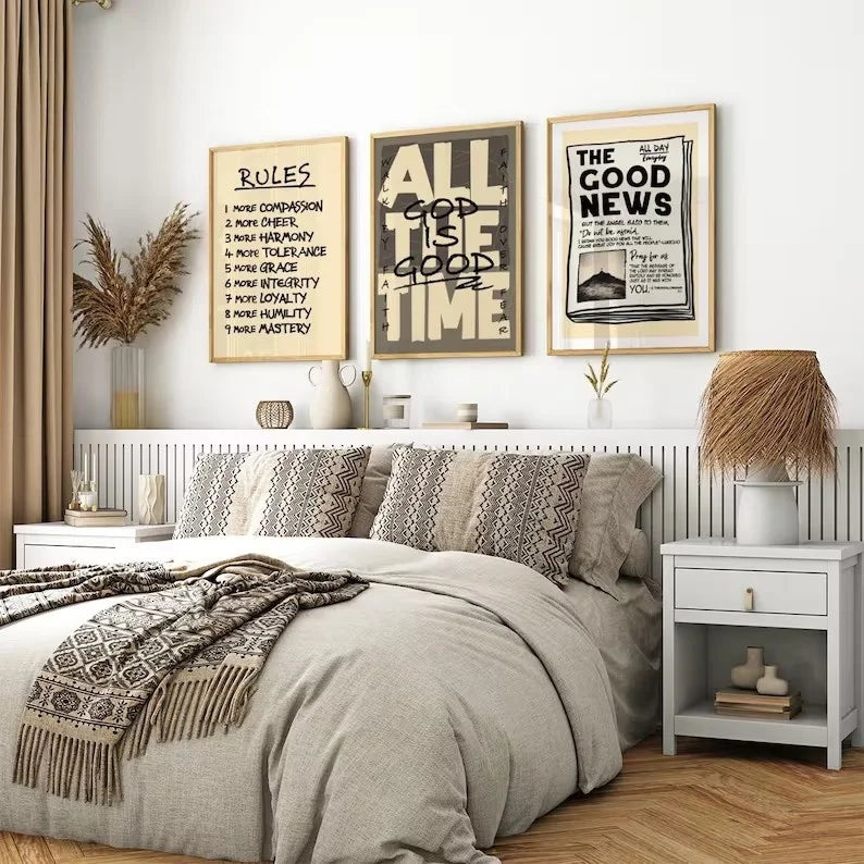A bedroom featuring a bed with neutral bedding and three framed scripture art pieces on the wall.
