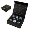 A black gift box containing a natural stone zodiac bracelet and various crystals with corresponding zodiac signs.