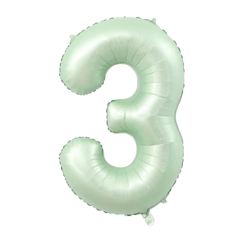 A light mint green foil number balloon shaped like the number three.