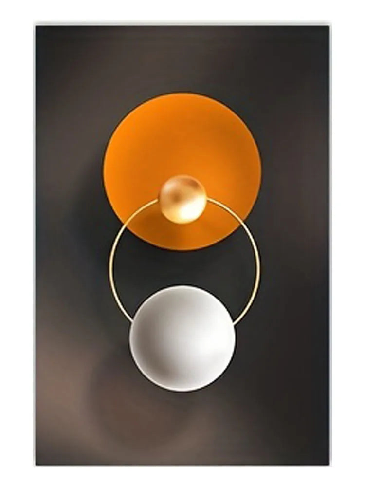 Abstract wall art featuring two concentric circles, one orange and one silver, against a dark gray background.