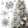 A set of six glittered artificial white Christmas flowers with clips displayed next to a decorated evergreen tree.