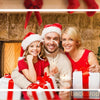 A family of three celebrating Christmas in front of a stone fireplace with greenery and red accents.