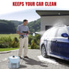A man is using a cordless high-pressure cleaning gun to wash the exterior of a blue car.