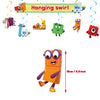 A set of colorful building block decorations featuring characters like a monster, a robot, and various figures hanging from a