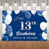 A dark blue backdrop decorated with silver and white balloons and confetti for a 13th birthday party.