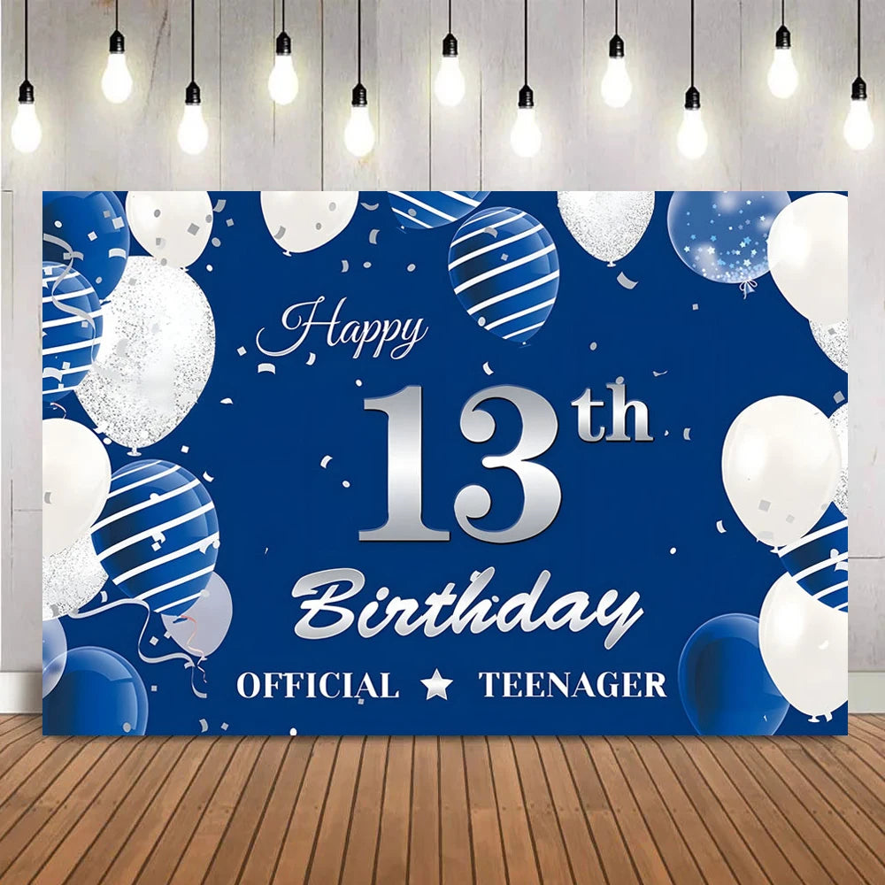 A dark blue backdrop decorated with silver and white balloons and confetti for a 13th birthday party.