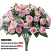 A bouquet of pink silk roses and green eucalyptus leaves for wedding or home decor.