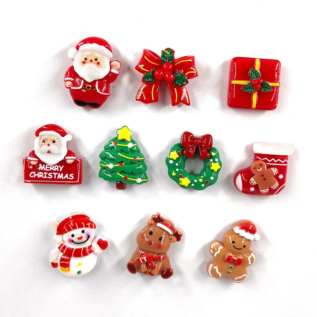 Un juego de lindos imanes navideños que incluye a Santa, una caja de regalo roja, un árbol de Navidad, una corona y figuras d