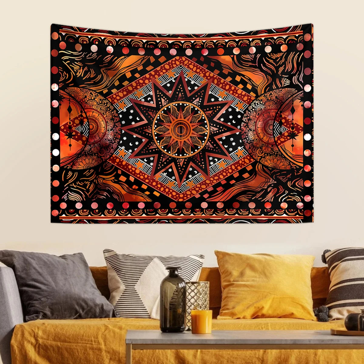 Bohemian sun and moon tapestry wall hanging featuring intricate orange, black, and gold patterns.