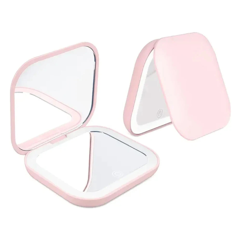 A pink compact portable vanity mirror with a hinged design showing both a mirror and a magnifying lens.