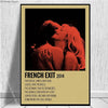 A poster featuring a close-up of two people embracing against a dark background with red lighting and the text FRENCH EXIT 20