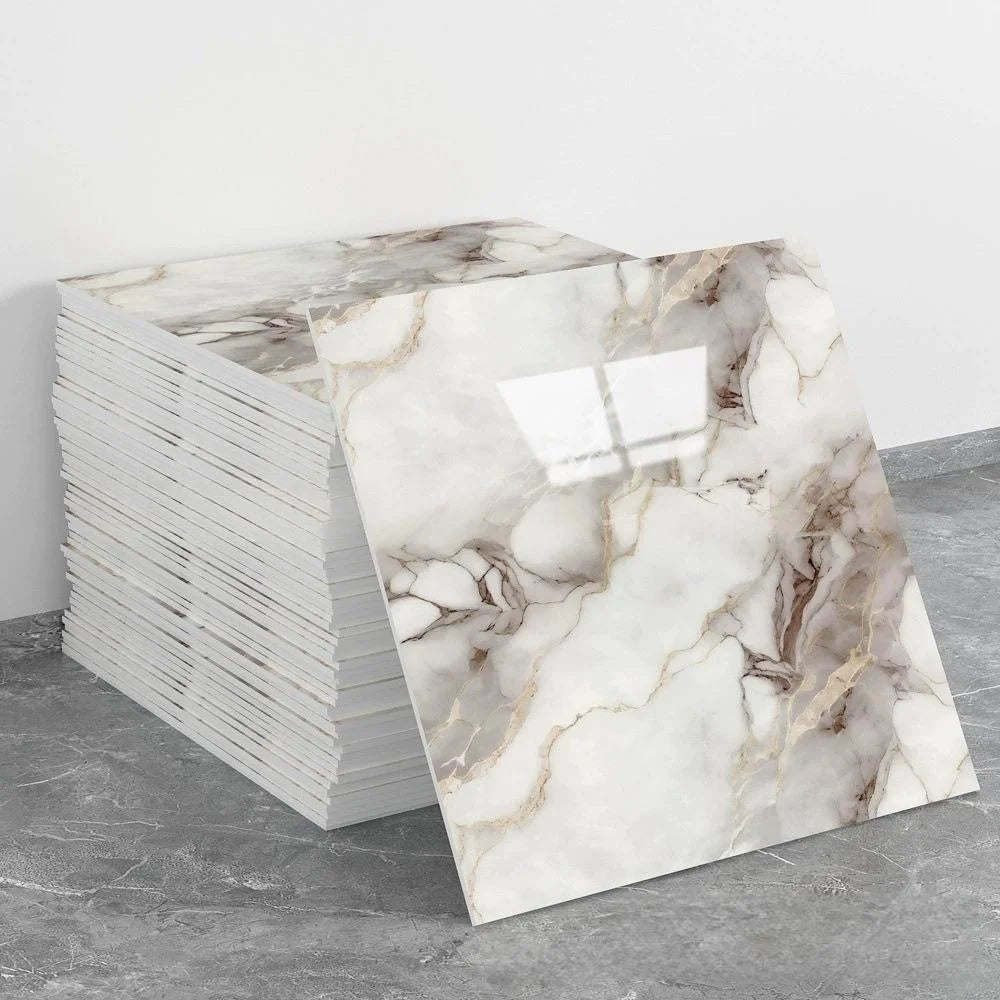 A stack of self-adhesive marble tile stickers featuring a beige and brown veined marble pattern.