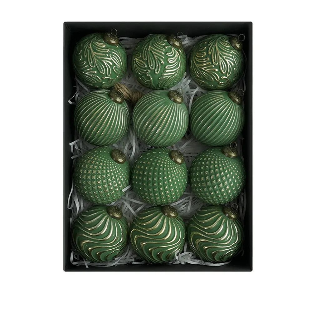 A set of twelve green, textured Christmas tree ball ornaments displayed in a black box.