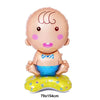 A round, light pink foil balloon shaped like a baby with a bow tie sitting on a yellow base.