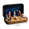 A nativity scene figurine set featuring figures and animals set in a storage tin with a starry blue background