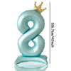 A light blue foil number balloon shaped like the number 8 with a gold crown on top