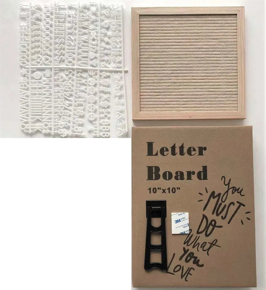 A pink felt letter board featuring white letters and a wooden stand.