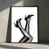A black and white portrait of a woman's legs and feet, captured in a high-fashion style.