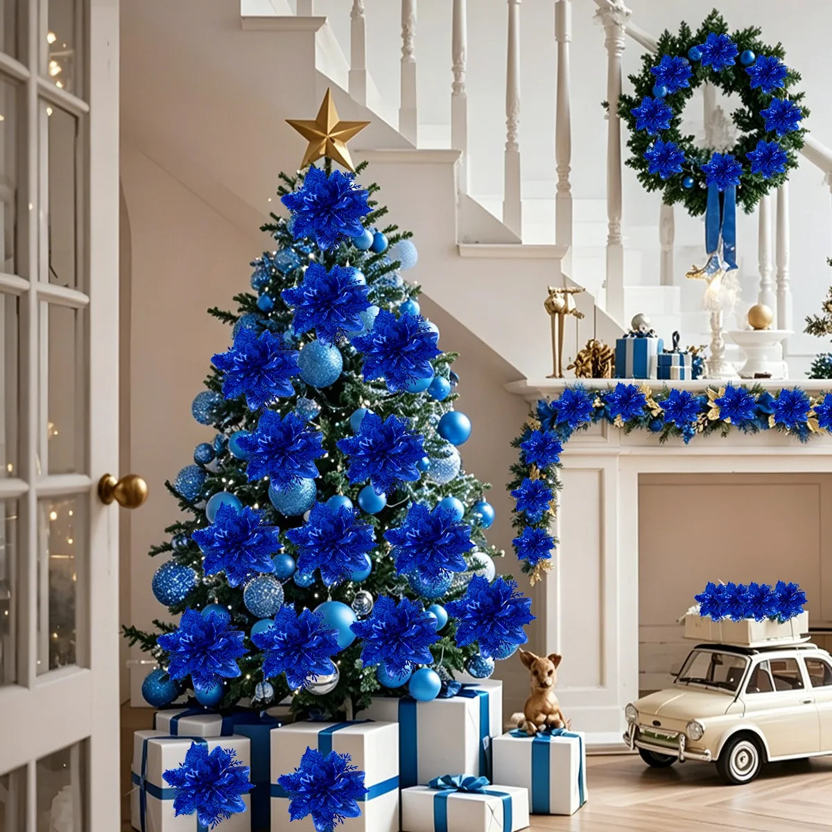 A decorated Christmas tree covered in blue glitter artificial poinsettia flowers and blue ornaments.