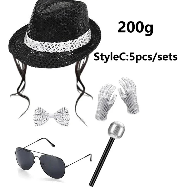 A black sequin disco hat, tie, and glove set with a silver-colored accessory shown next to sunglasses.
