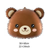 A brown inflatable teddy bear decoration used for a birthday party.
