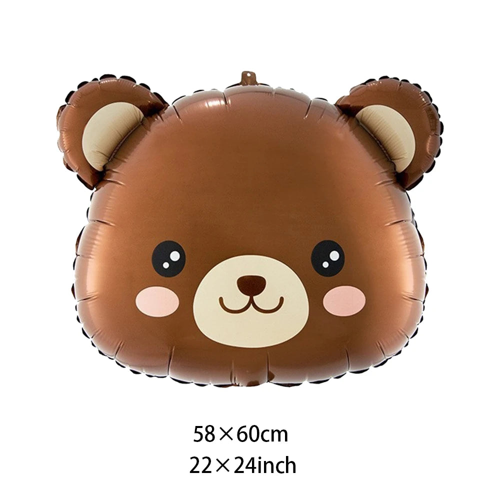 A brown inflatable teddy bear decoration used for a birthday party.