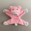 A pink plush animal designed as a pig, featuring white accents.