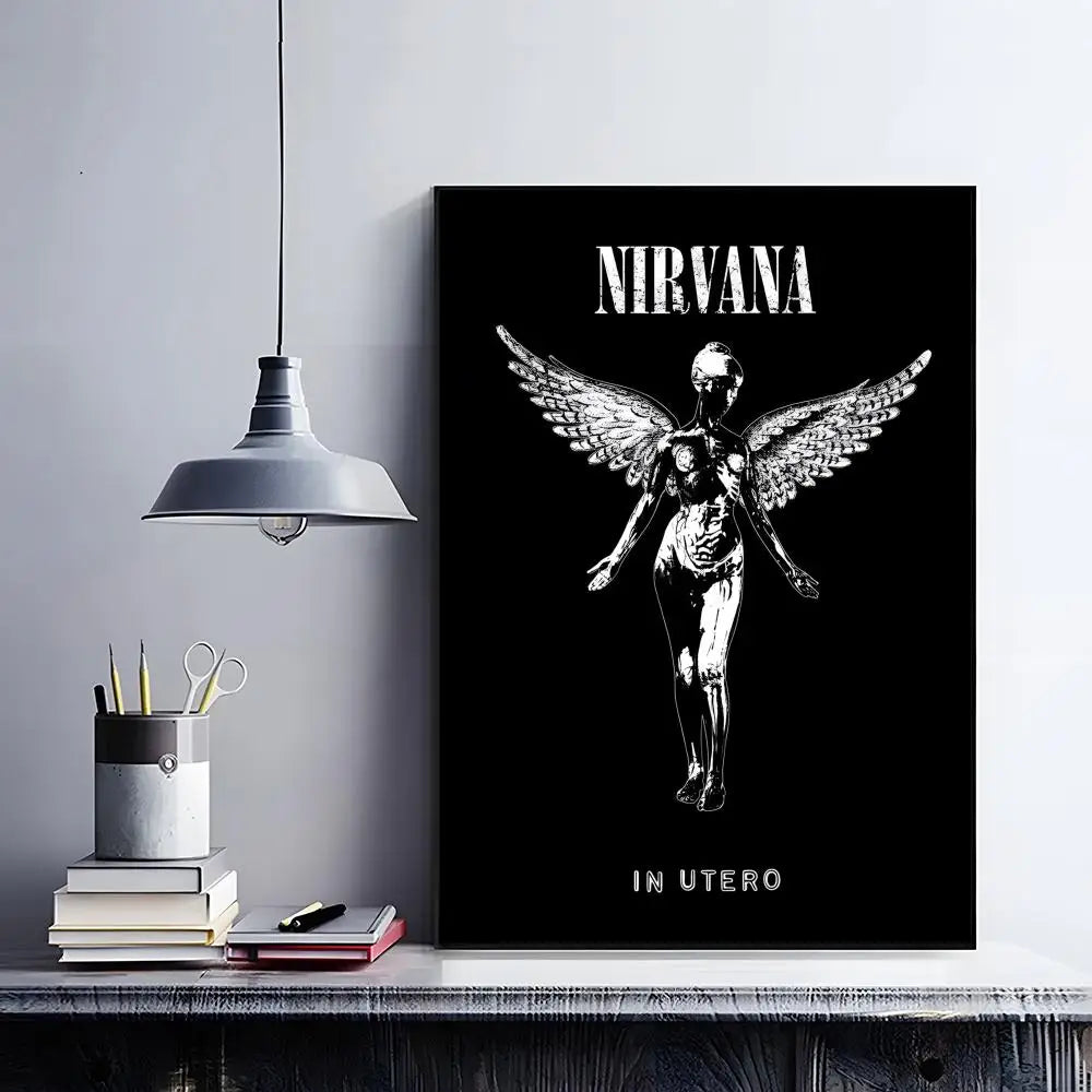 A black poster featuring a silhouette of a winged figure with the text Nirvana in utero.